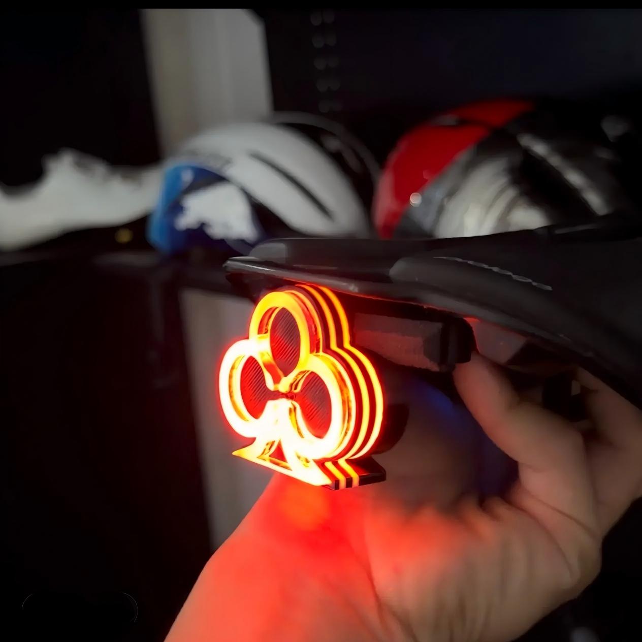 ECM New Road Bike Tail Light: Sleek "Lightning" Design, Rechargeable, Long Battery Life, Waterproof, and App-Controlled Color/Lighting Modes.